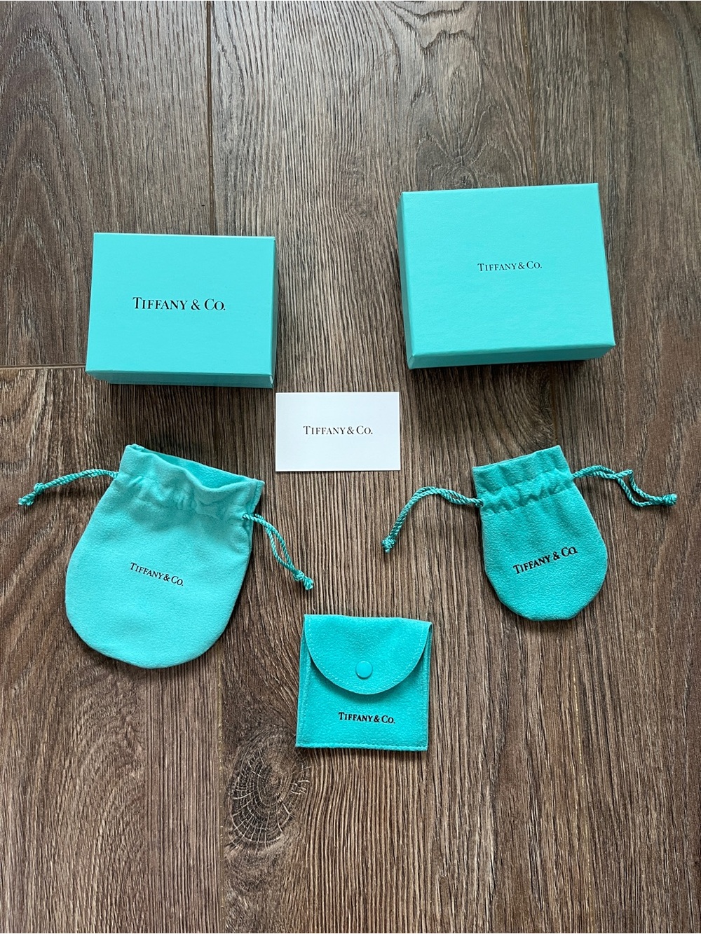 Set of empty Tiffany & Co. boxes, dust bags, and care tag